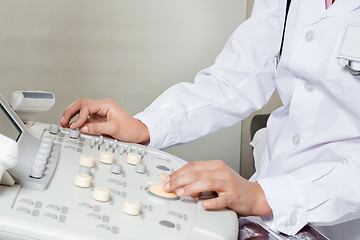 Image showing Female Radiologist Operating Ultrasound Machine