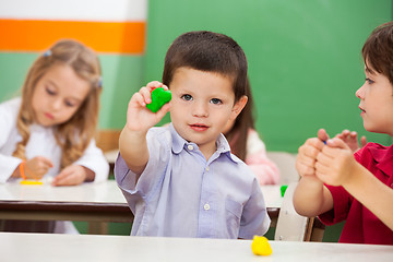 Image showing Boy Showing Clay At Classroom