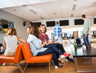 Image showing Man And Woman Conversing in Bowling Club