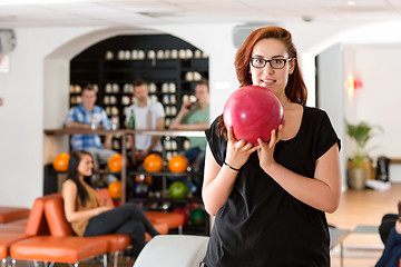 Image showing Young Woman Bowling in Club