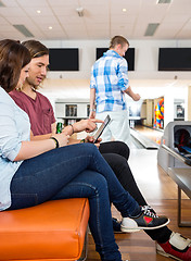 Image showing Couple Using Digital Tablet in Bowling Club