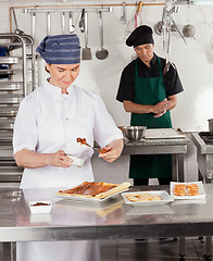 Image showing Female Chef Preparing Sweet Food