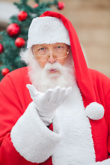 Image showing Santa Claus Blowing Kiss Outdoors