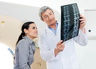 Image showing Radiologist And Patient Looking At X-ray