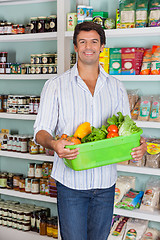 Image showing Man Holding Basket Of Vegetables In Supermarket