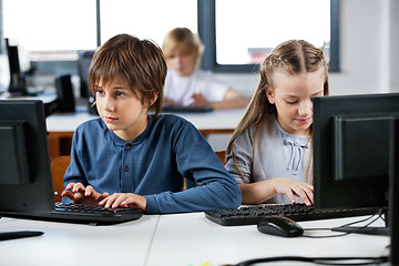 Image showing Schoolchildren Using Desktop Pc In Computer Lab