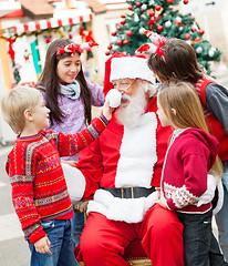 Image showing Friends Playing With Santa Claus