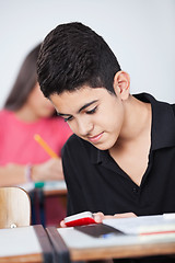 Image showing Teenage Schoolboy Text Messaging