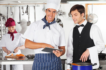 Image showing Chef With Waiter Using Digital Tablet