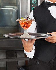 Image showing Waitress Holding Dessert Tray