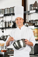 Image showing Young Chef With Wire Whisk And Mixing Bowl