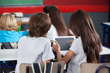 Image showing Schoolgirl Using Digital Tablet At Desk