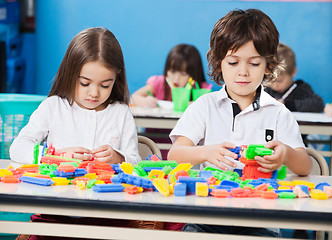 Image showing Children Playing With Construction Blocks In Classroom