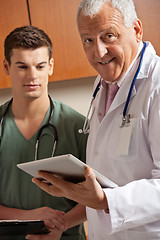 Image showing Senior Doctor Holding Clipboard