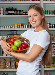 Image showing Woman Holding Fruits Basket At Supermarket