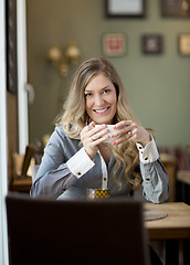 Image showing Attractive Woman in Cafe with Coffee