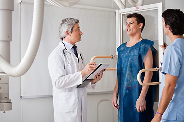 Image showing Radiologists Conducting X-ray On Male Patient