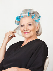 Image showing Senior Woman With Hair Curlers