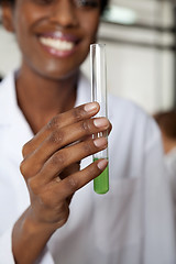 Image showing Teacher Holding Chemical Solution In Test Tube