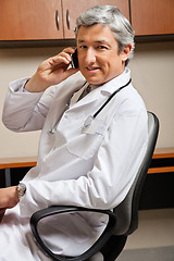Image showing Doctor Answering Phone Call