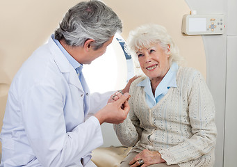 Image showing Doctor Comforting Senior Female Patient