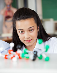 Image showing Beautiful Teenage Schoolgirl Looking At Molecular Structure