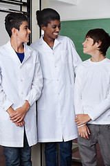 Image showing Teacher And Teenage Boys Standing Together