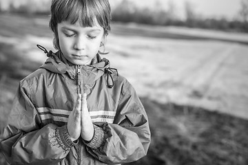 Image showing boy at prayer