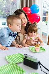 Image showing Family Celebrating Boy's Birthday