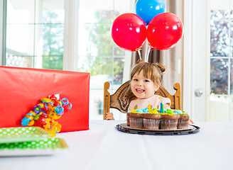 Image showing Birthday Girl With Cake And Present On Table