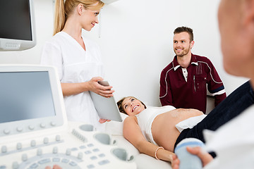 Image showing Gynecologist Showing Digital Tablet To Couple