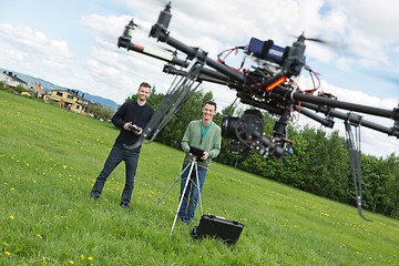 Image showing Engineers Flying UAV Helicopter in Park