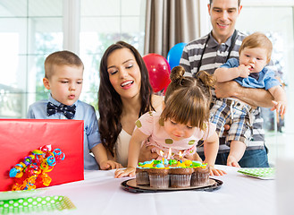 Image showing Girl Blowing Out Candles On Birthday Cake