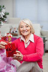 Image showing Happy Senior Woman With Christmas Gift