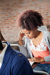 Image showing Student Thinking While Giving Exam In Classroom