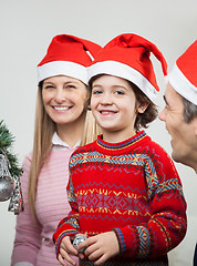 Image showing Family In Santa Hats During Christmas
