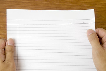 Image showing Hand holding blank writing paper

