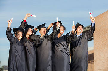 Image showing Students With Diplomas Standing Together On University Campus