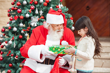 Image showing Girl Taking Gift From Santa Claus