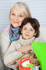 Image showing Grandmother Embracing Boy During Christmas