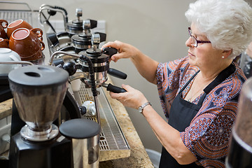 Image showing Barista Preparing Coffee In cafe