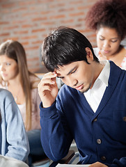 Image showing Student Thinking With Classmates In Classroom