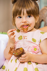 Image showing Girl Eating Birthday Cake With Icing On Her Face