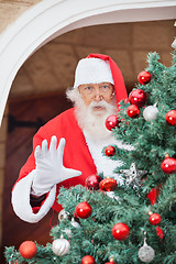 Image showing Santa Claus Gesturing From Christmas Tree