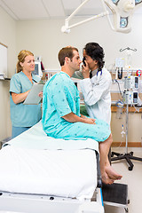 Image showing Doctor With Ophthalmoscope Examining Patient's Eye In Hospital