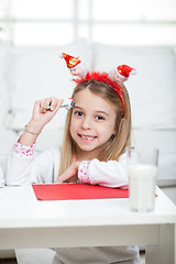 Image showing Happy Girl With Pencil And Cardpaper