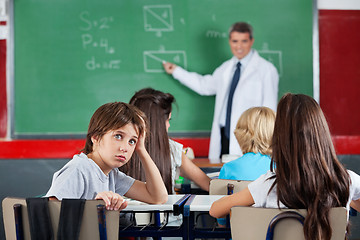 Image showing Portrait Of Young Schoolboy Leaning At Desk