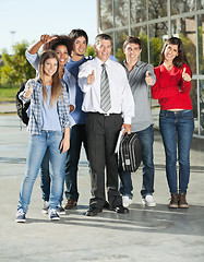 Image showing Confident Students And Professor Gesturing Thumbsup On Campus