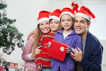 Image showing Parents And Children With Christmas Gift