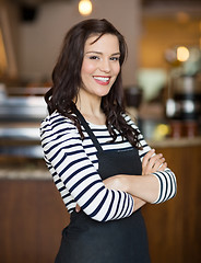 Image showing Happy Waitress Standing In Cafe